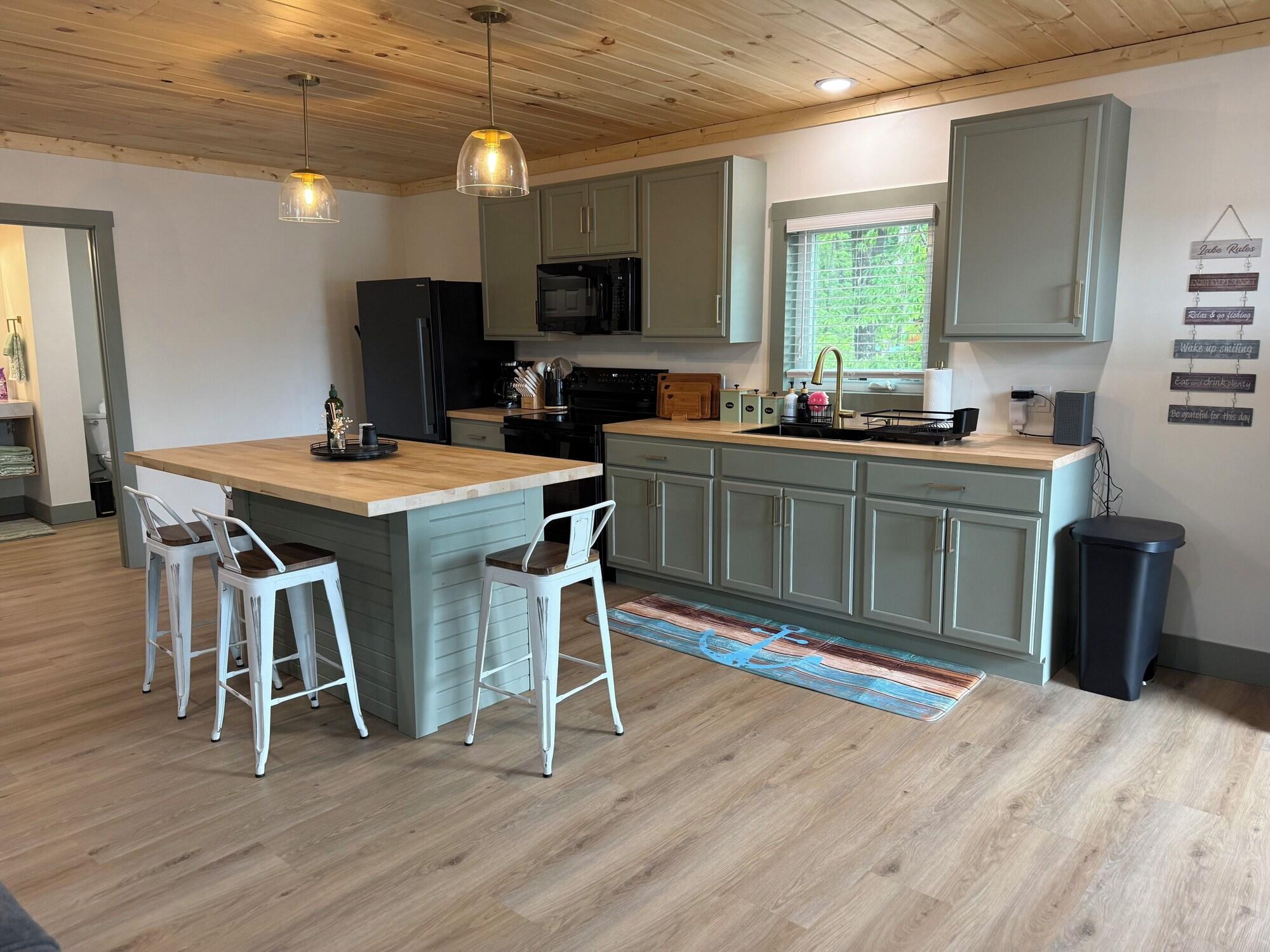 Kitchenette with island and bar stools at Hideaway at Wolf Creek
